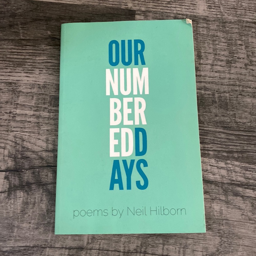 Button poetry book. “Our Numbered Days” by Neil Hilborn